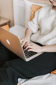 woman typing on a laptop