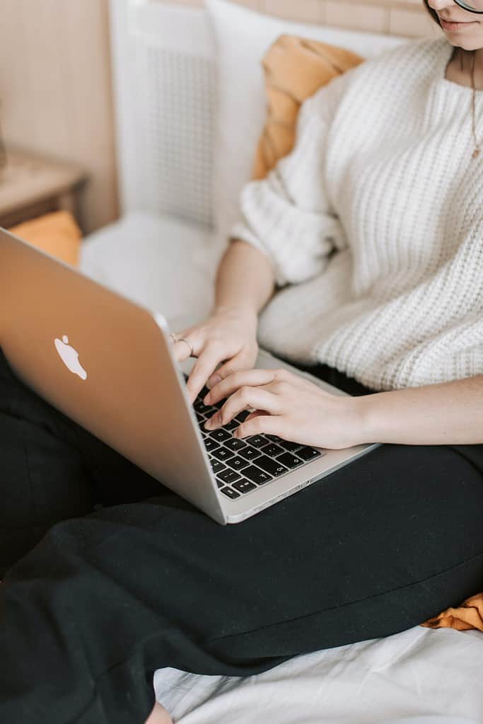 woman typing on a laptop