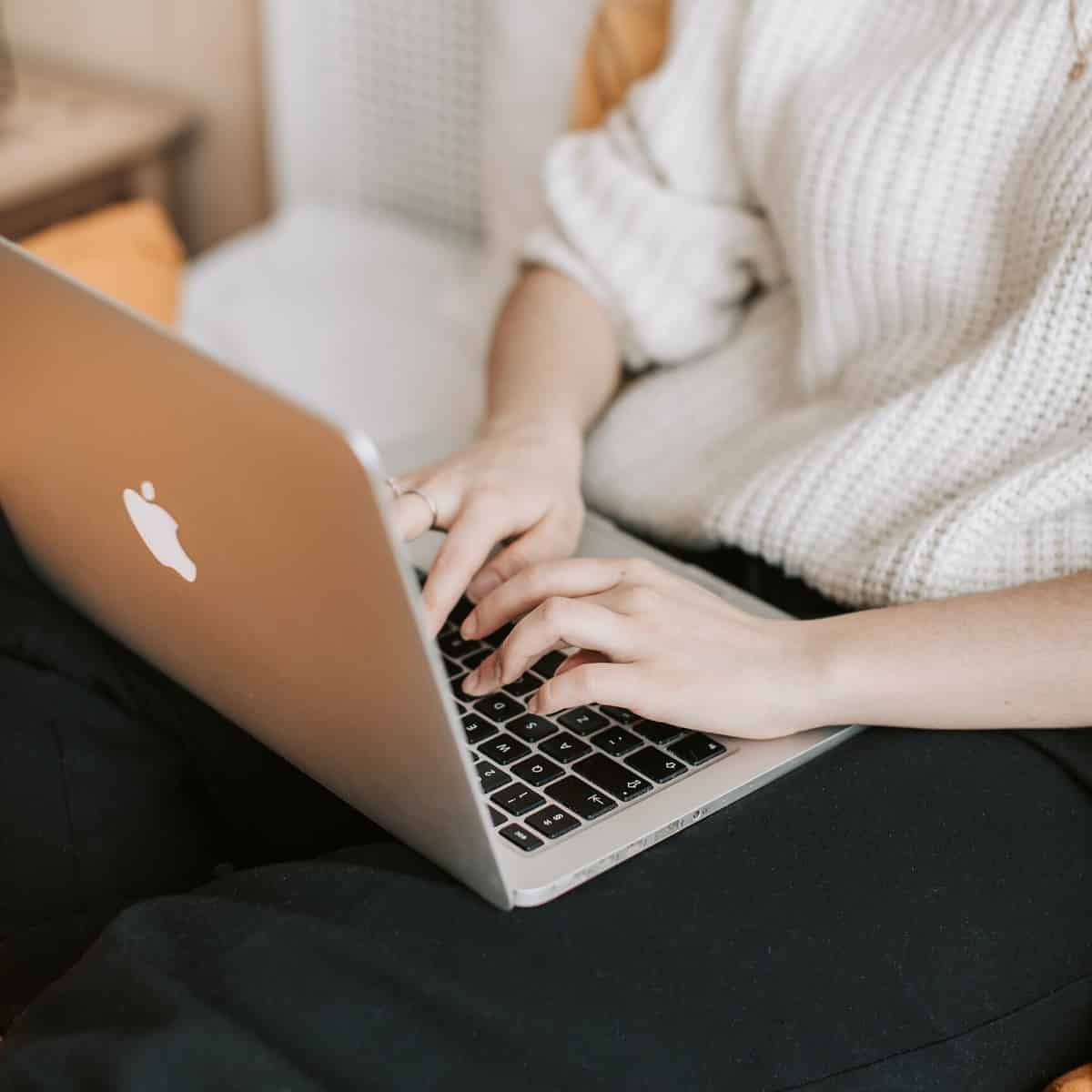 woman typing on a laptop