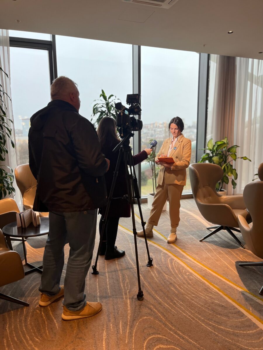 academic public speaker being interviewed at a conference