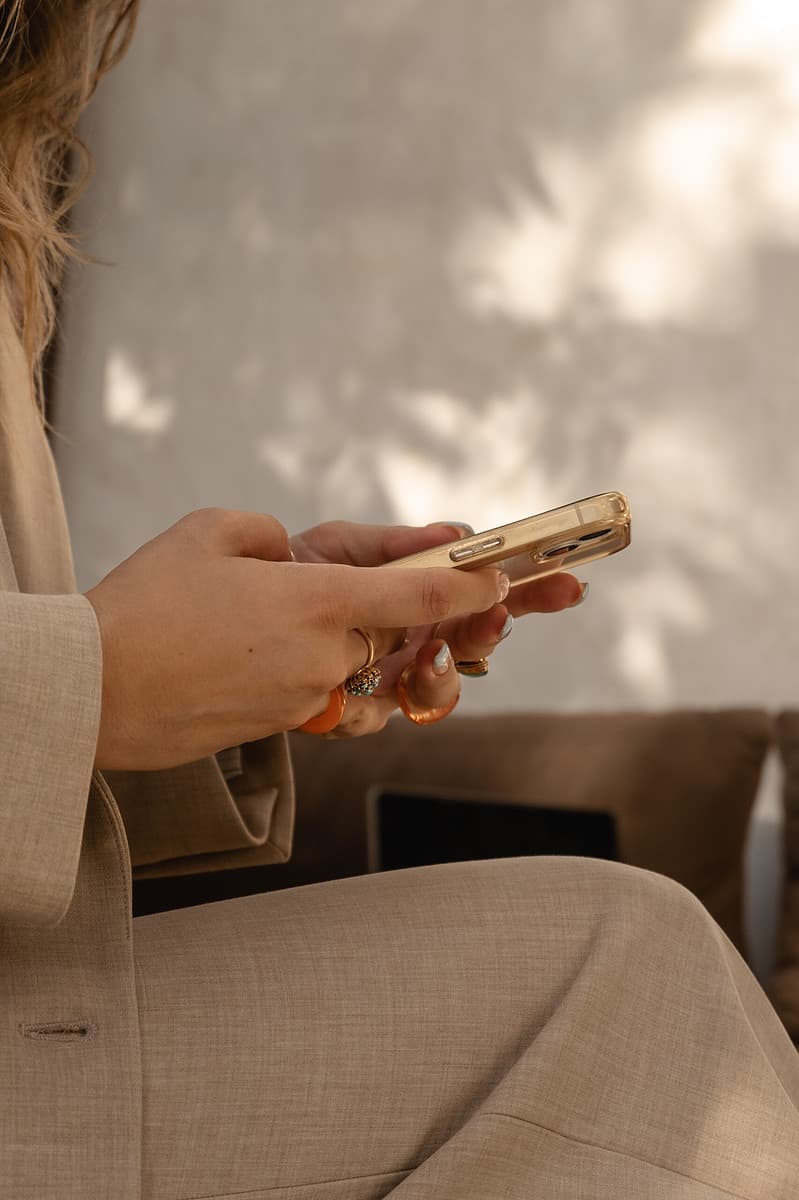 a woman typing on her phone