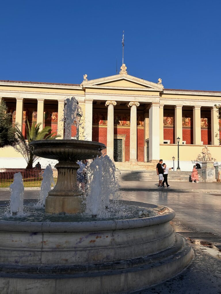 a square with a fountain in Athens, Greece