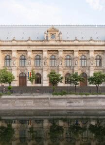 Building with Statues near River in Bucharest