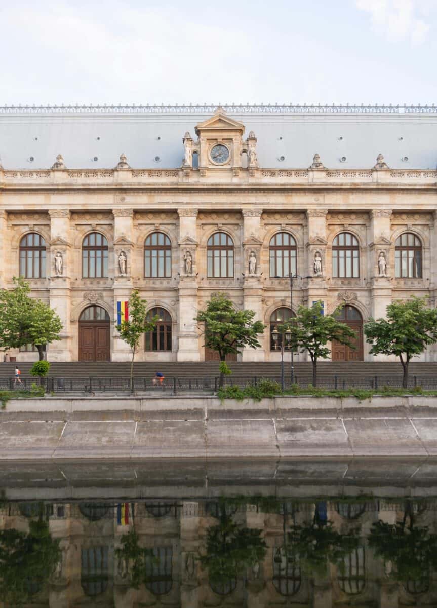 Building with Statues near River in Bucharest