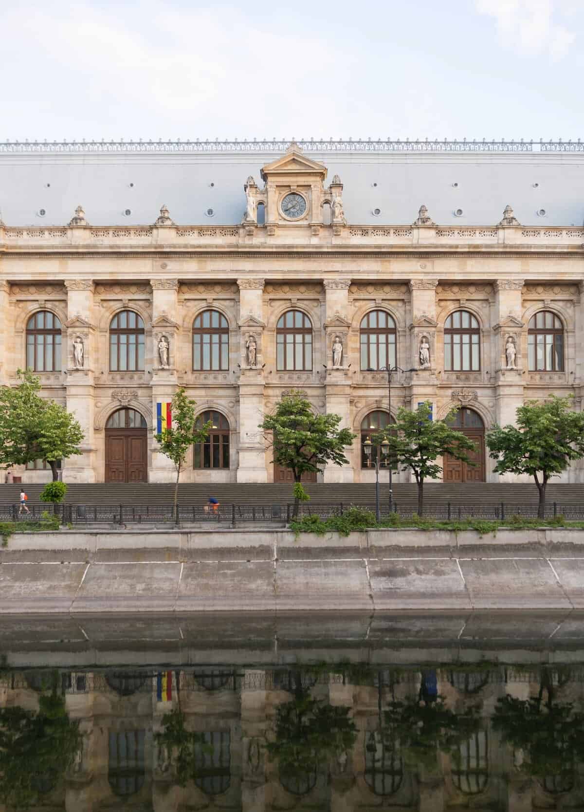 Building with Statues near River in Bucharest