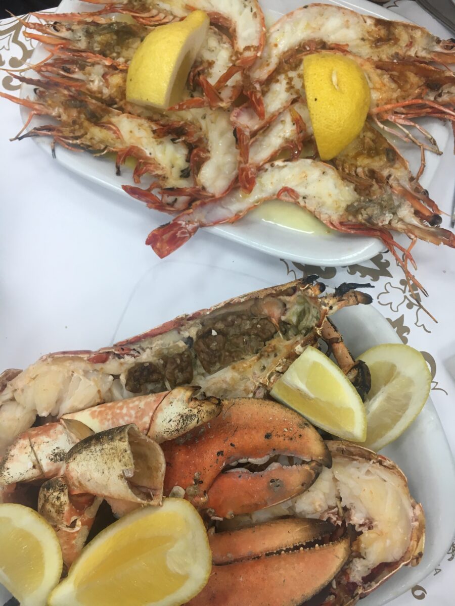 opulent seafood with olive oil and lemon quarters on a table of a restaurant in Lisbon