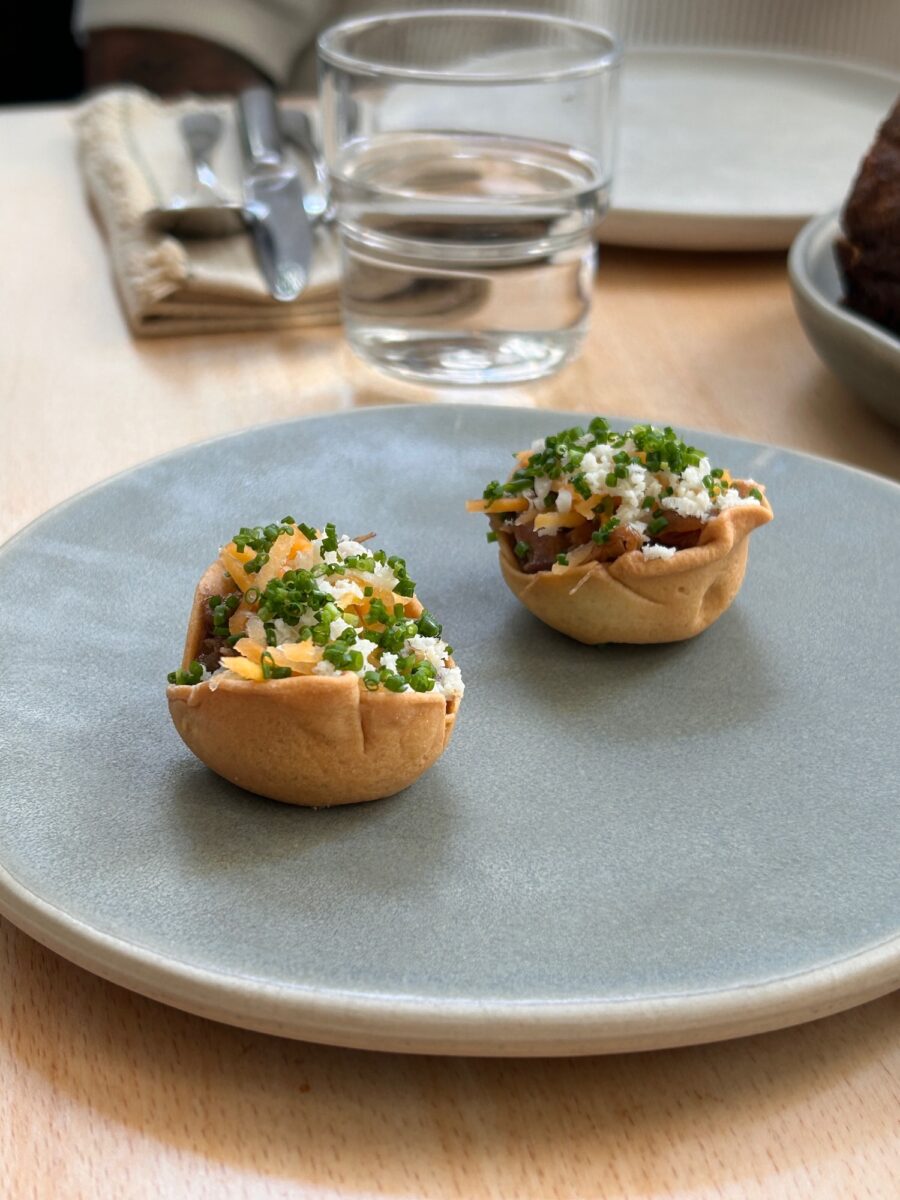 sophisticated canapés on a small plate in a restaurant of Lisbon