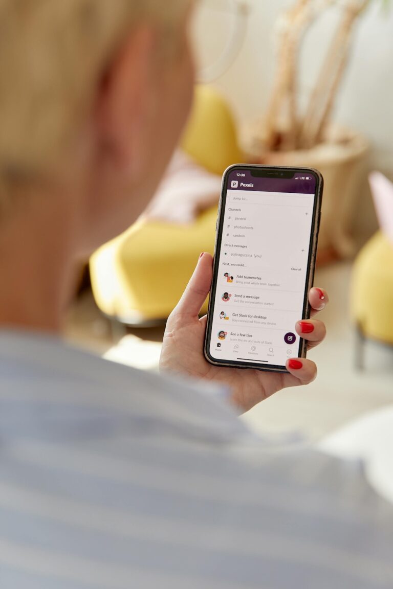 a view from the back of a woman holding a phone