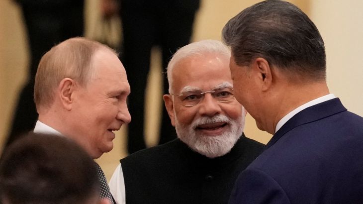 Indian Prime Minister Narendra Modi talks with Russian President Vladimir Putin and Chinese President Xi Jinping.Xi, Putin and Modi pledge unity at summit to counter US-led global order