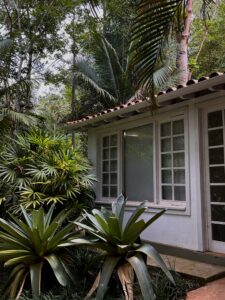 a traditional colonial house in a lush garden in Minas Gerais, Brazil