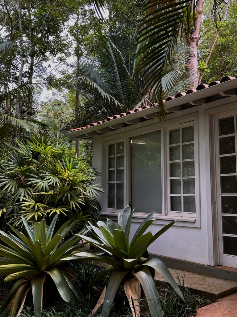 a traditional colonial house in a lush garden in Minas Gerais, Brazil
