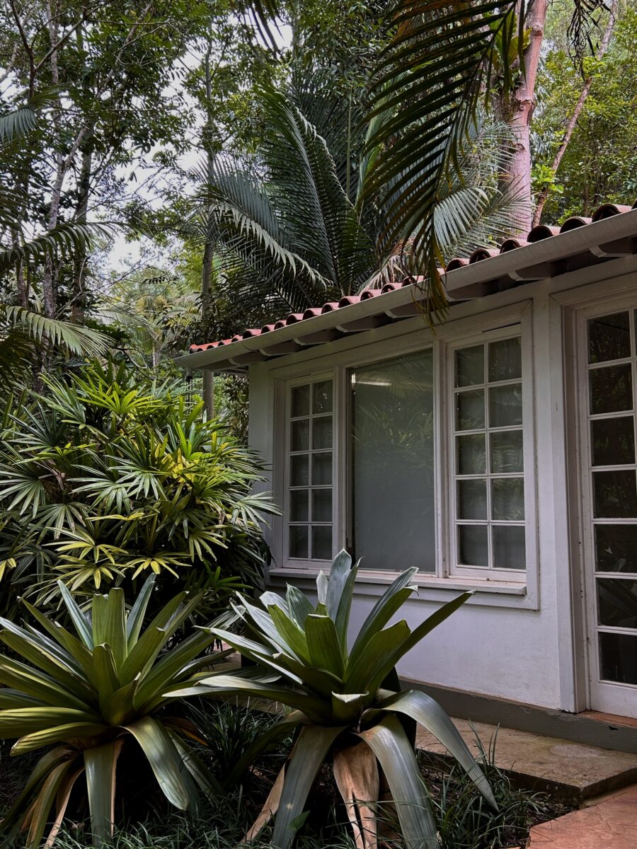 a traditional colonial house in a lush garden in Minas Gerais, Brazil